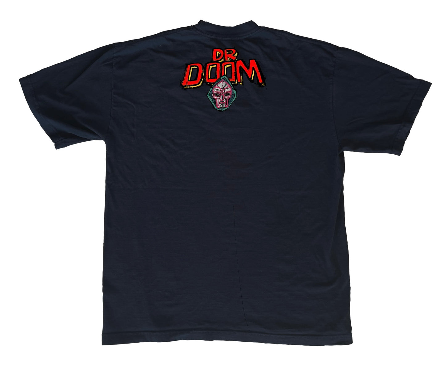 The Ultimate Villain with a Tribute to MF DOOM
This T-shirt captures the essence of Doomsday as the ultimate villain—even to other villains. In this powerful tribute to MF DOOM, Doomsday is depicted triumphantly taking down some of Marvel’s most iconic antagonists, including Thanos, Galactus, Ultron, and Magneto. Not only does he dominate the greatest villains, but he also faces off against his long-time adversaries, the Fantastic Four.
This piece blends epic storytelling with a nod to one of the greatest