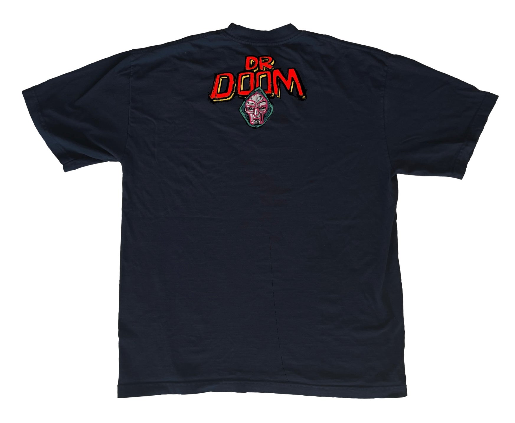 The Ultimate Villain with a Tribute to MF DOOM
This T-shirt captures the essence of Doomsday as the ultimate villain—even to other villains. In this powerful tribute to MF DOOM, Doomsday is depicted triumphantly taking down some of Marvel’s most iconic antagonists, including Thanos, Galactus, Ultron, and Magneto. Not only does he dominate the greatest villains, but he also faces off against his long-time adversaries, the Fantastic Four.
This piece blends epic storytelling with a nod to one of the greatest